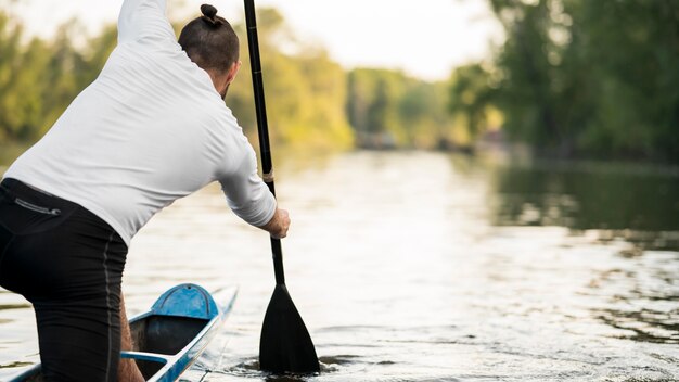 Back view man rowing