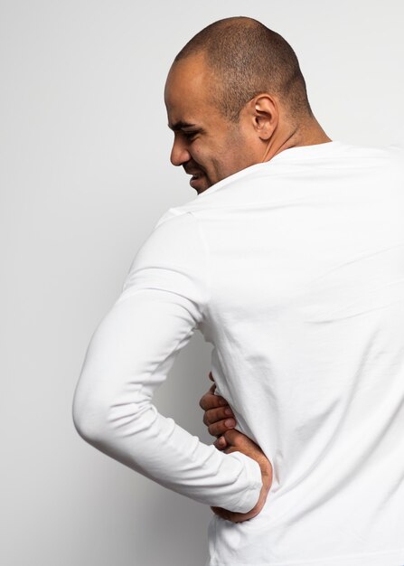Back view of man suffering from side pain