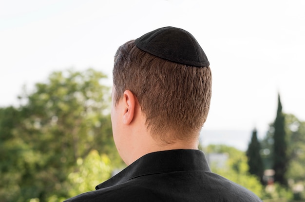 Free photo back view of man with kippah