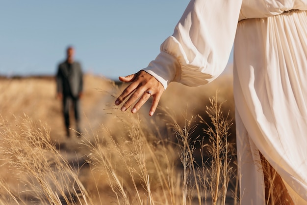 Free photo back view married woman wearing ring