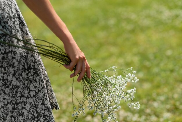 Back view model holding flowers