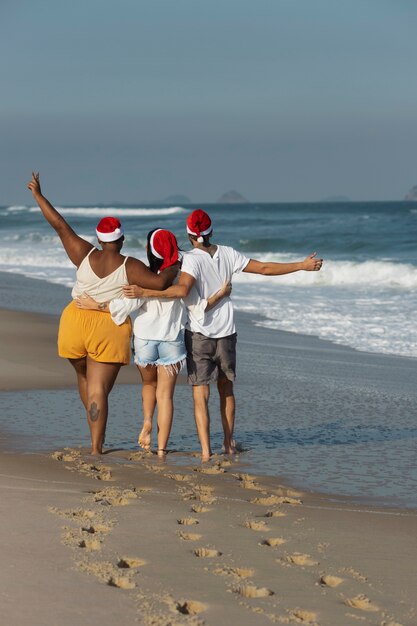 Back view people walking on beach