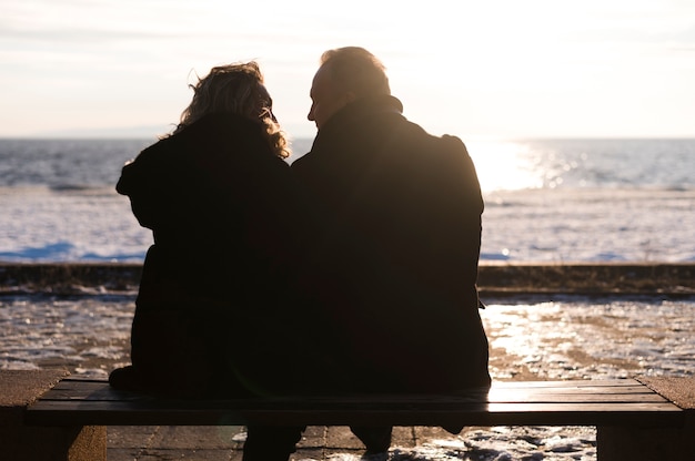 Free photo back view senior couple enjoying view