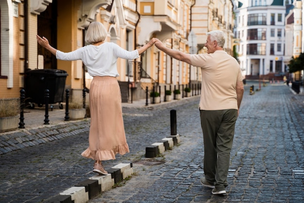 Back view of senior couple enjoying a walk outdoors