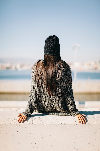 Back view of woman in harbor environment