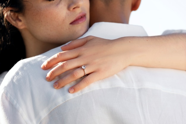 Free photo back view woman hugging man