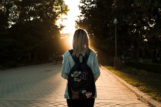 Back view woman looking at sunset