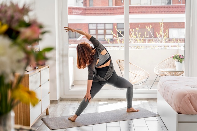 Free photo back view woman stretching