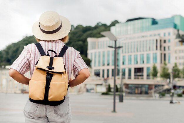 Back view woman traveling alone