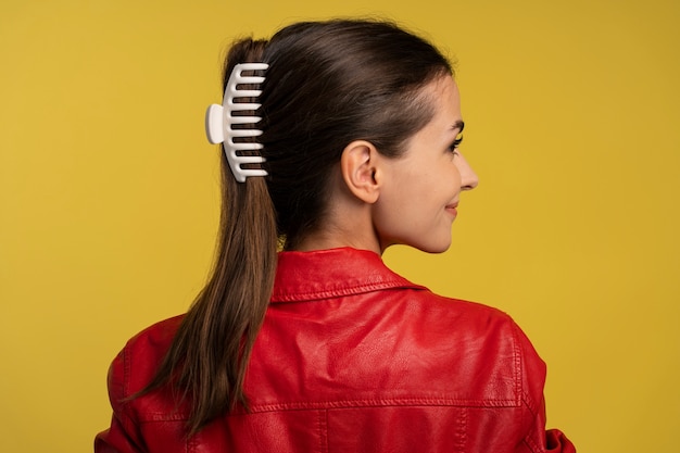 Back view woman  wearing big hair clip