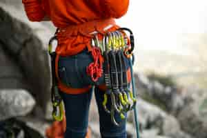 Free photo back view woman with climbing  equipment