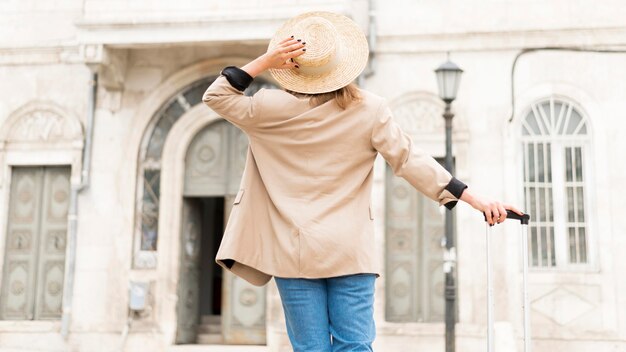 Back view woman with hat