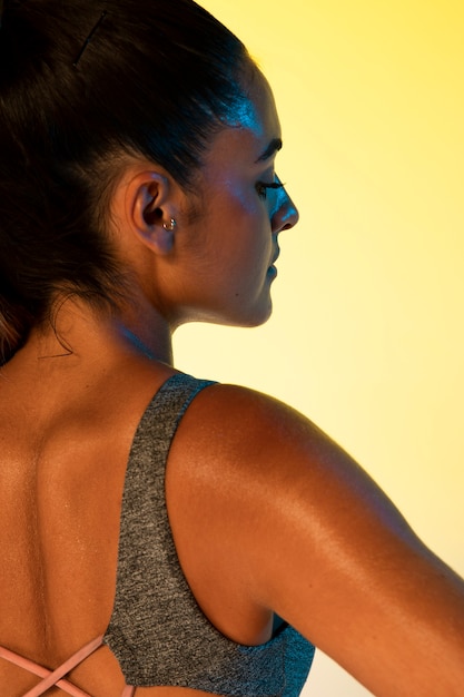 Back view of woman and yellow background