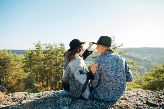 Back view young couple in the nature