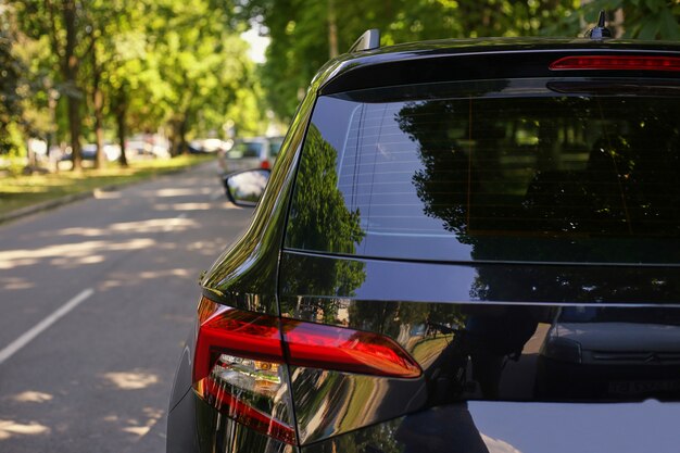 Download Premium Photo | Back window of white car parked on the street in summer sunny day, rear view ...