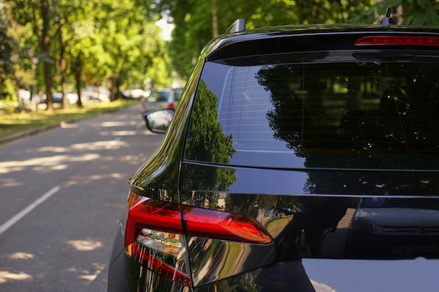 Download Premium Photo | Back window of white car parked on the street in summer sunny day, rear view ...