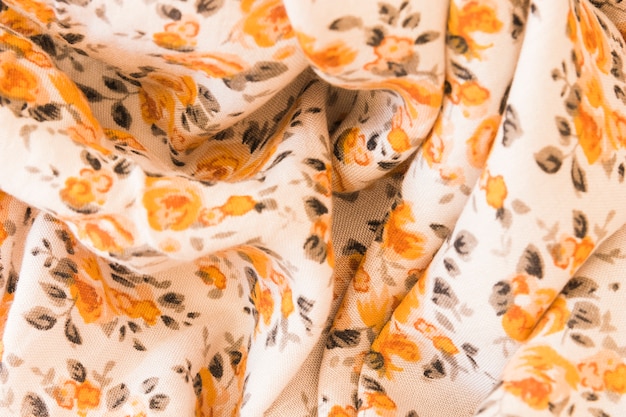 Backdrop of an orange floral fabric