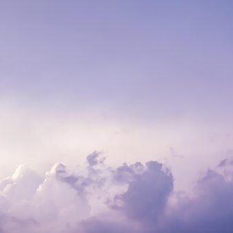 Background of a beautiful pink and pale purple sky with clouds at sunset. high quality photo