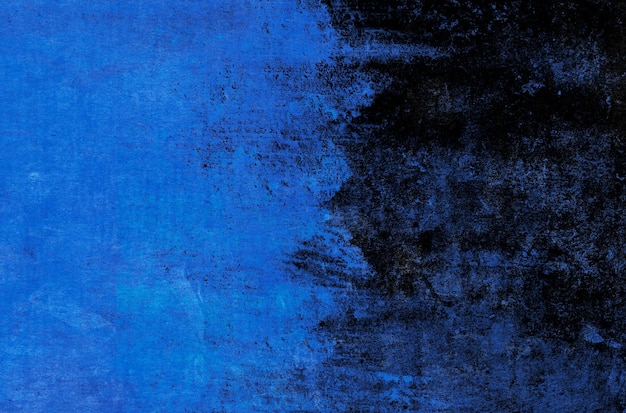 Sfondo di tratti di vernice blu su sfondo nero