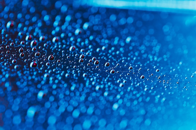 Background of blue water drops on the some surface