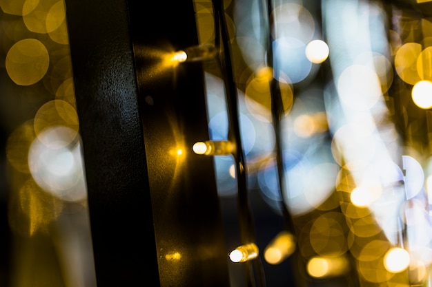 Background of blurred glowing christmas golden lights