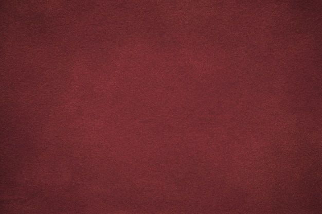 Background of dark red suede fabric