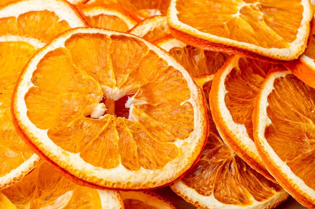 Background of dried orange slices side view