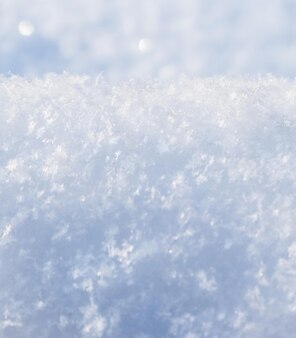 Background of fresh snow. natural winter background. snow texture in blue tone