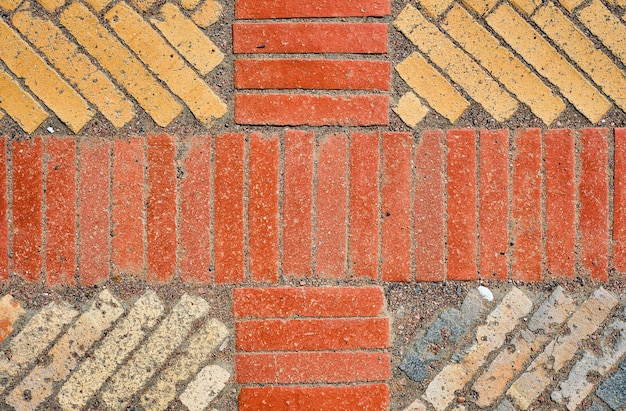 Background from old brick ceramic cobblestone top view Old tracks laid out in geometric patterns The idea of a wallpaper for a table or screensaver for advertising with space for text