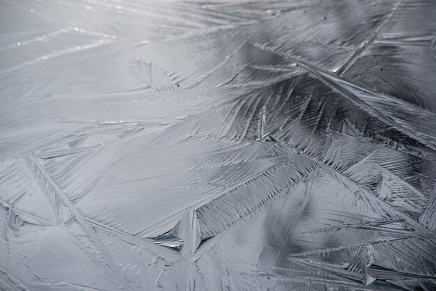 Background of a frosted surface with beautiful crystal patterns