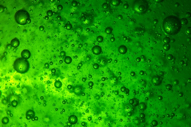 Background of a lot of air bubbles in a green liquid
