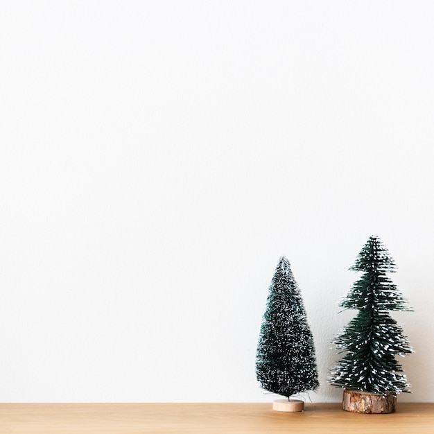 Free photo background mini christmas pine trees