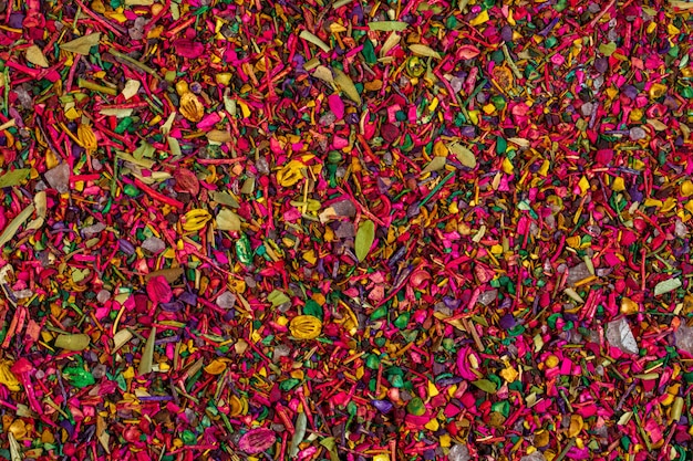Background of multicolored dried flower petals blooms and herbs top view