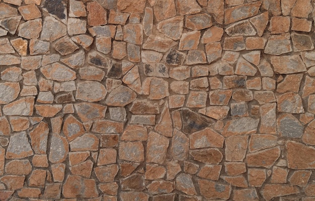 Free photo background of old wall of irregularly shaped stones