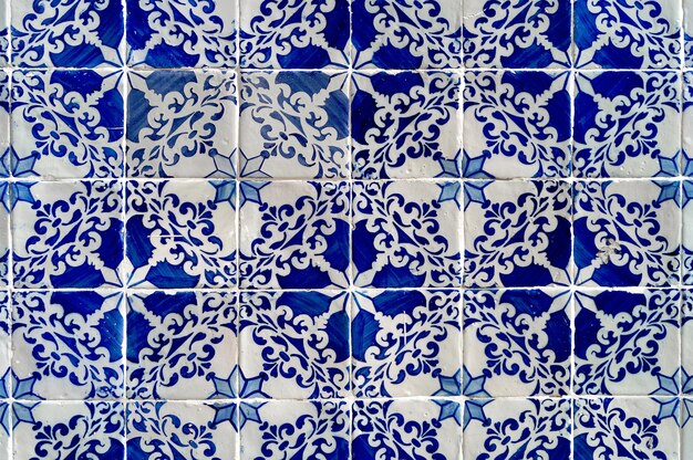 Background photograph of antique Portuguese tile pattern in blue and white