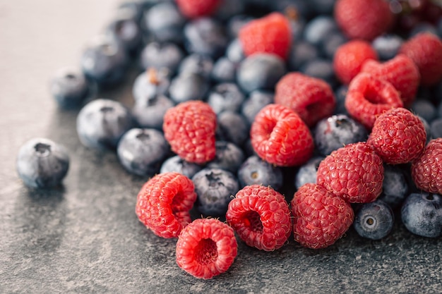 Free photo background of raspberries and blueberries macro photography