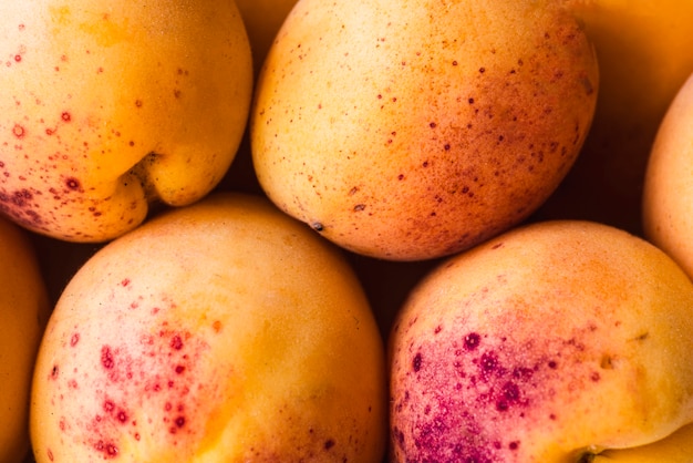 Free photo background of ripe apricots
