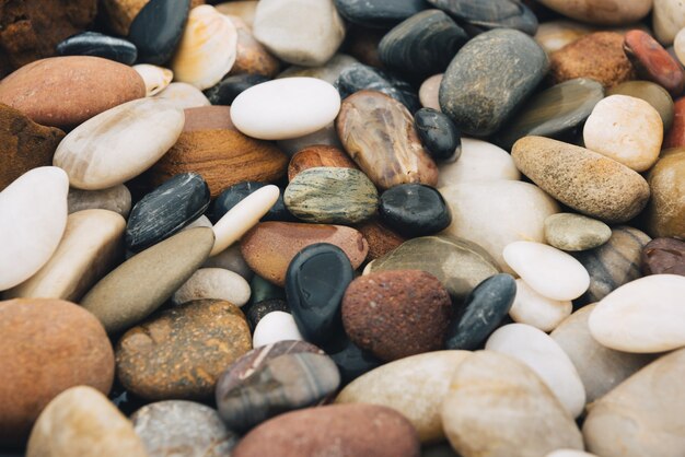 Background of riverstones pile, beautiful round stones.