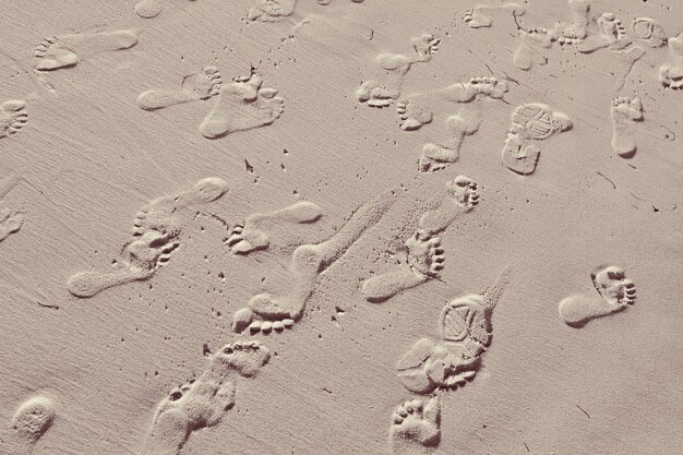 Background of a sandy surface with people footprints