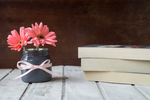 Background of table with books and flowers