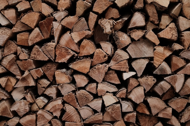 Background or wallpaper of wooden planks in a pile stacked up on each other