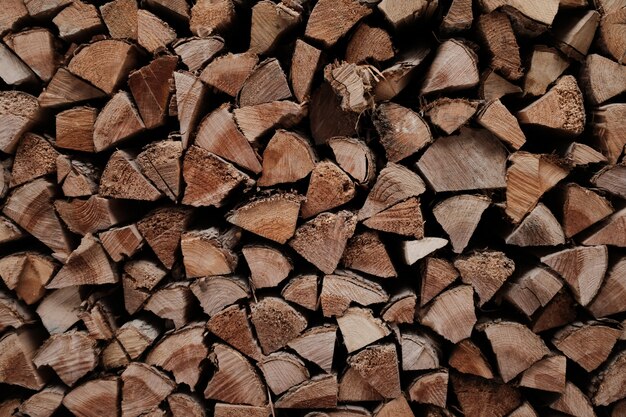 Background or wallpaper of wooden planks in a pile stacked up on each other