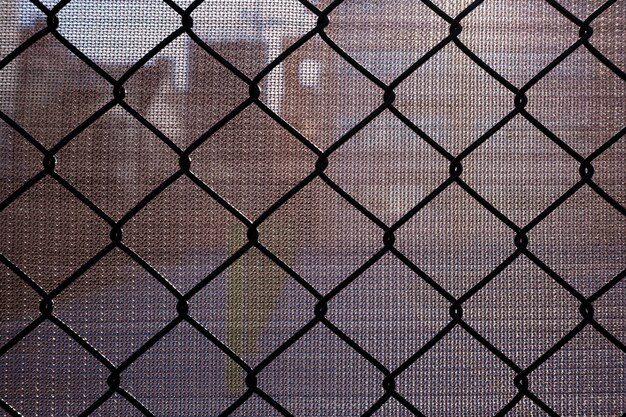 Background with metallic fence texture