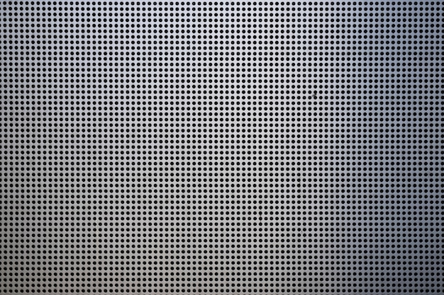 background with metallic mesh and round holes