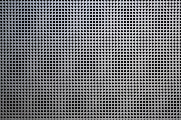 Background with metallic mesh and round holes