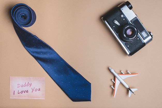 Background with necktie, plane and camera for father's day