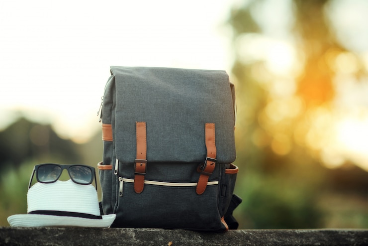 Free Photo backpack with sunset