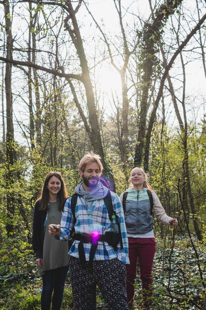 Backpacker friends in forest