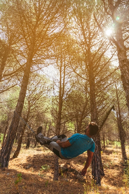 Free photo backpacker sleeping in hammock