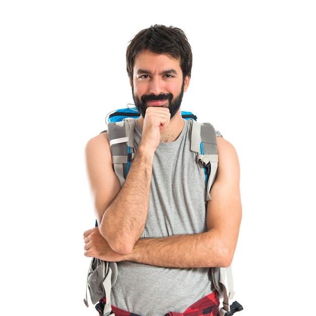 Backpacker thinking over isolated white background